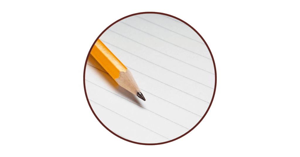 Pencil on lined notebook paper representing the question of what to say in the letter to your future self.