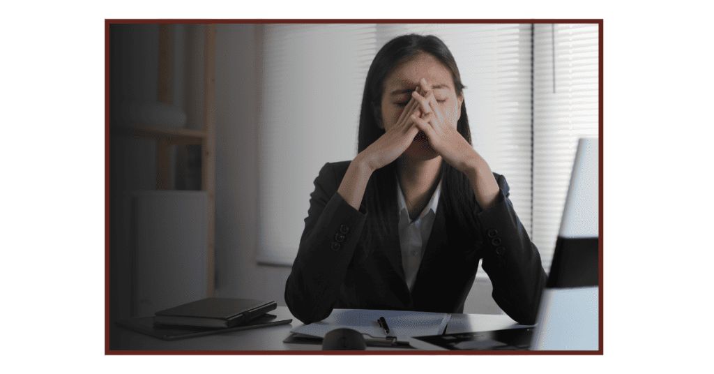 Image of woman at work who is overworked.